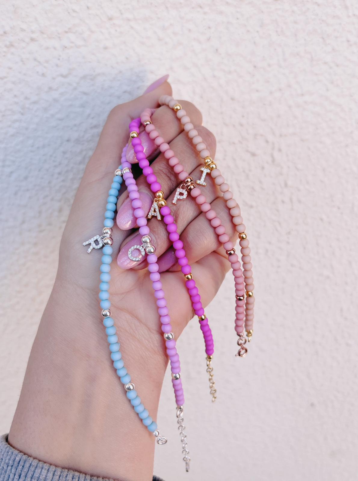 Bracciali rainbow letterina zirconi