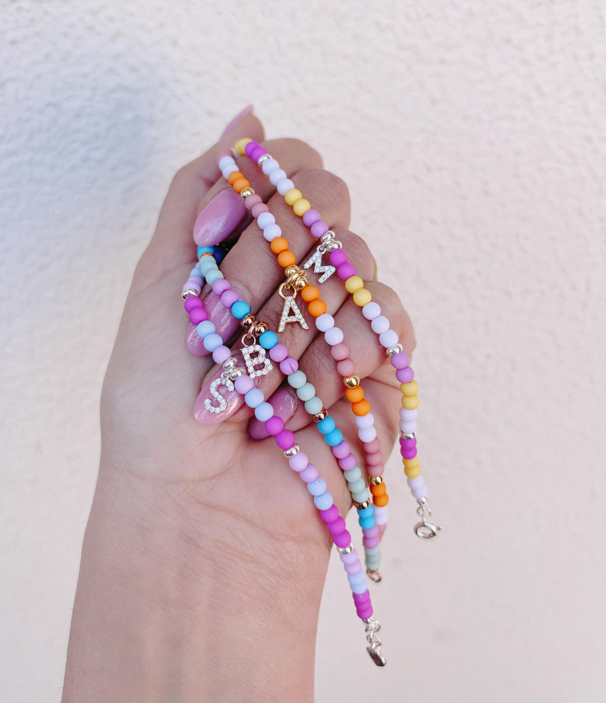 Bracciali rainbow letterina zirconi