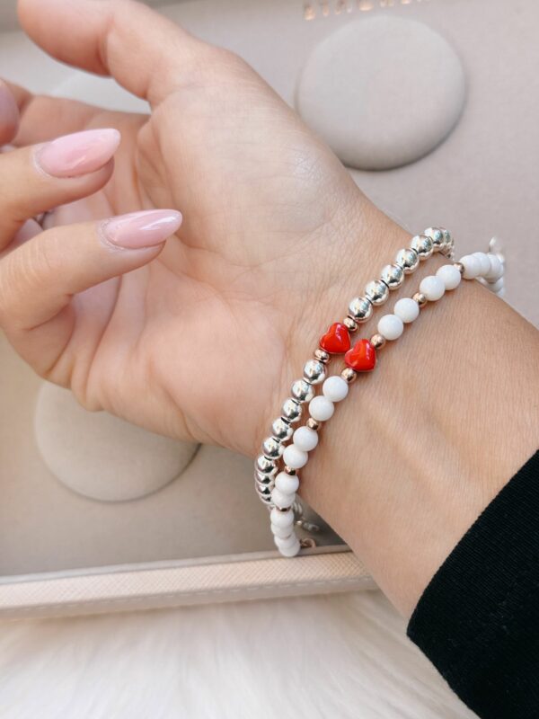 Bracciale sfere neve e cuore rosso - immagine 2